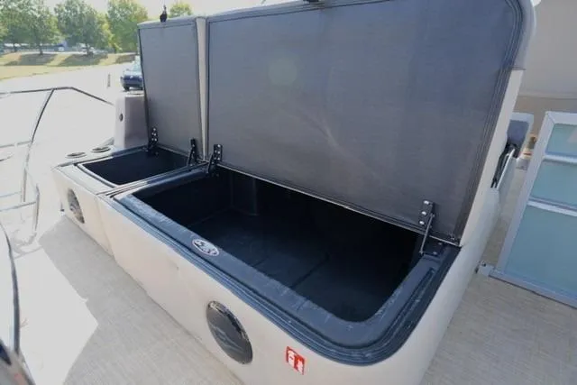 Slide: The Image of Open storage compartment on 2026 Harris Cruiser 210 boat, showcasing spacious interior. - 17