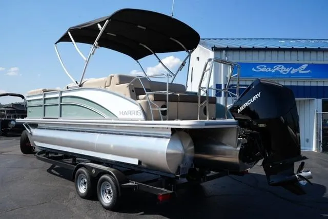 Slide: The Image of 2026 Harris Cruiser 210 pontoon boat with Mercury engine on trailer. - 7