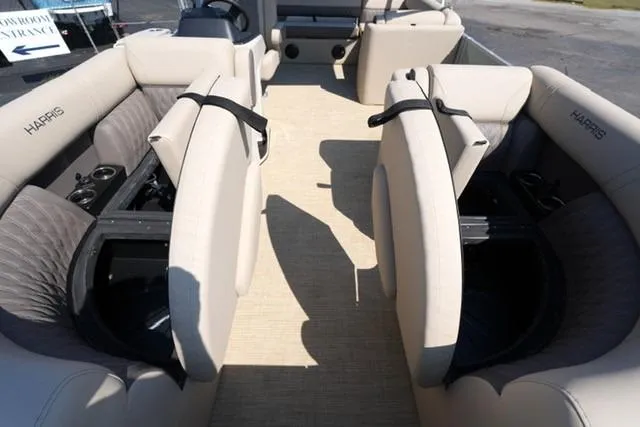 Slide: The Image of 2026 Harris Cruiser 210 interior with beige seating and spacious layout. - 9