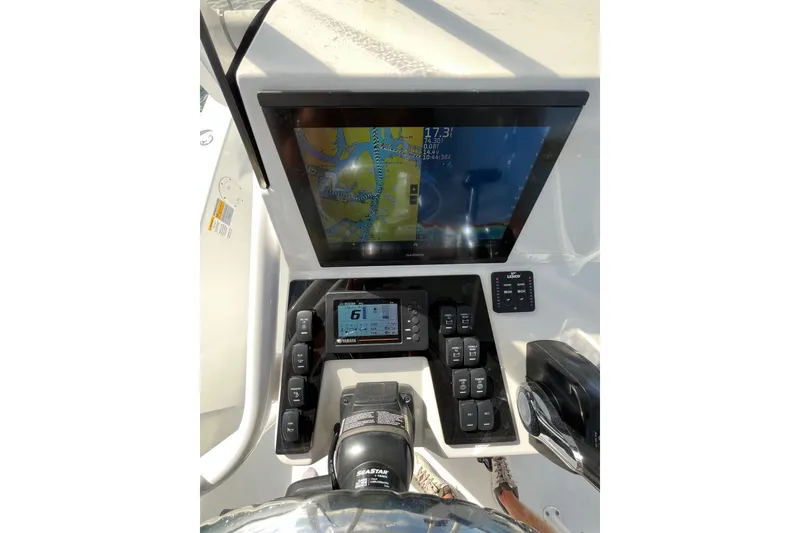 Slide: The Image of Dashboard of 2022 BlackJack 224 boat with navigation and control systems. - 10
