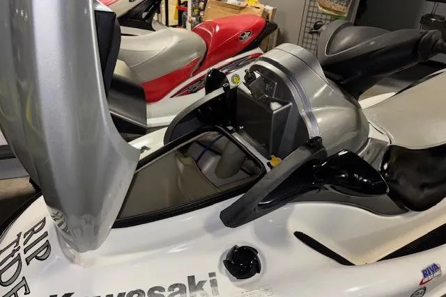 Slide: The Image of 2008 Kawasaki Jet Ski STX-15F in a garage, partially disassembled. - 10