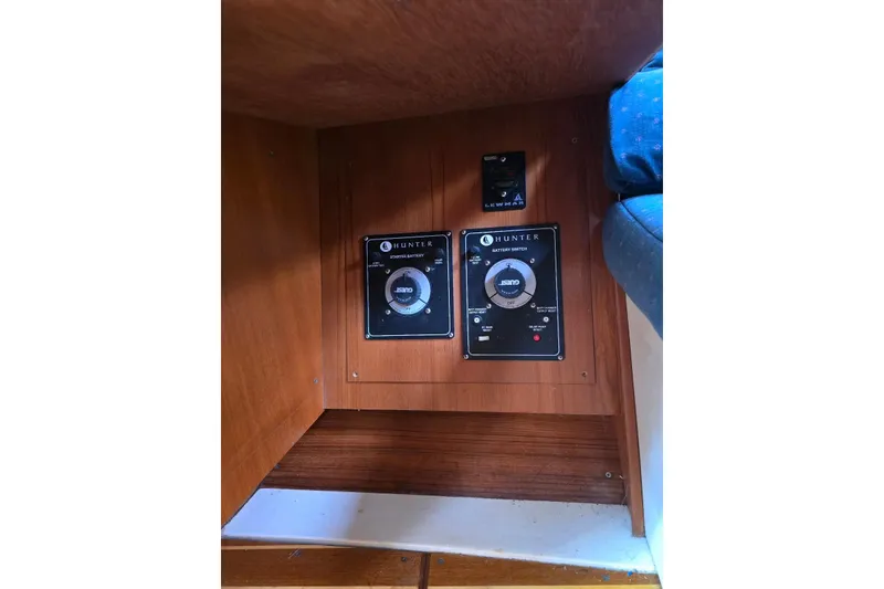 Slide: The Image of Control panel of a 2003 Hunter 386 sailboat with battery switches. - 14