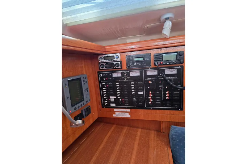 Slide: The Image of Control panel of a 2003 Hunter 386 sailboat with navigation and communication equipment. - 15