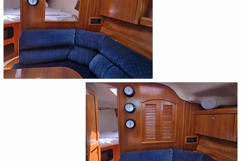 Slide: The Image of Interior of 2003 Hunter 386 sailboat with blue cushioned seating and wooden cabinetry. - 36