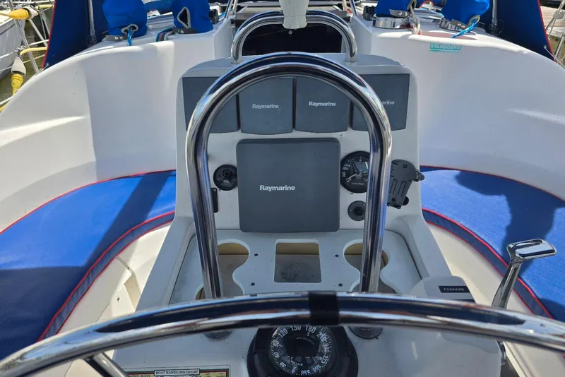 Slide: The Image of Cockpit of 2003 Hunter 386 sailboat with Raymarine navigation equipment. - 7