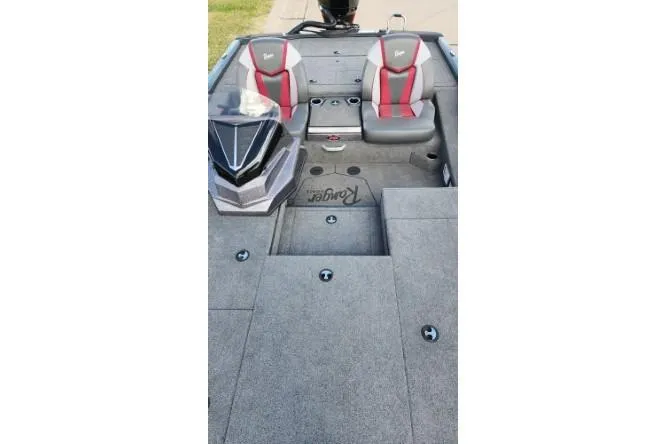 Slide: The Image of 2025 Ranger ALPHA 208 boat interior with dual seats and carpeted deck. - 6