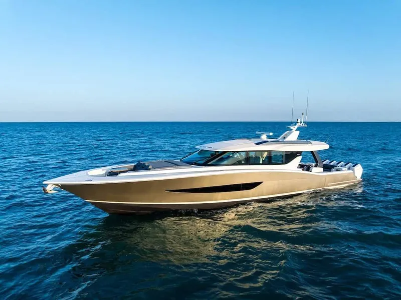 The Image of 2026 Scout 670 LX luxury yacht cruising on open sea under clear blue sky. - 0