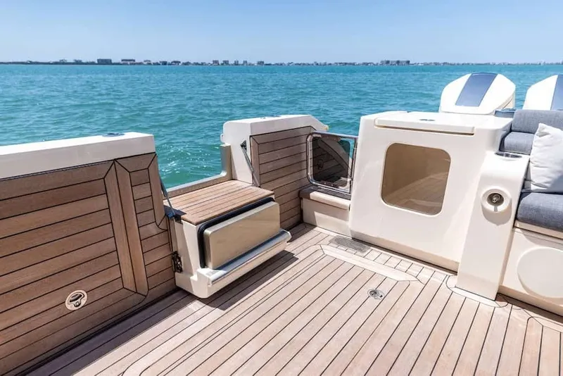 Slide: The Image of Luxurious 2026 Scout 670 LX boat deck with elegant wood finish and ocean view. - 10
