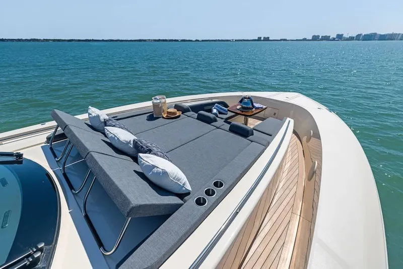 Slide: The Image of Luxurious 2026 Scout 670 LX yacht with sunbathing deck on tranquil ocean waters. - 20