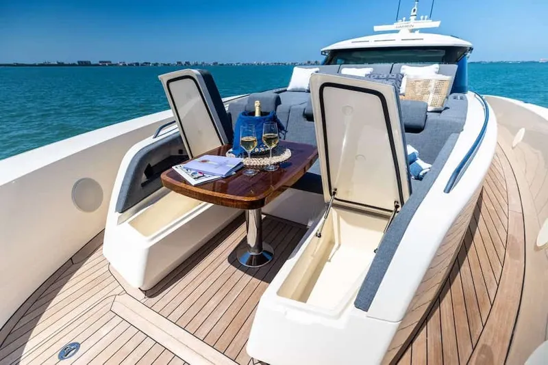 Slide: The Image of Luxurious 2026 Scout 670 LX yacht deck with seating, table, and ocean view. - 21
