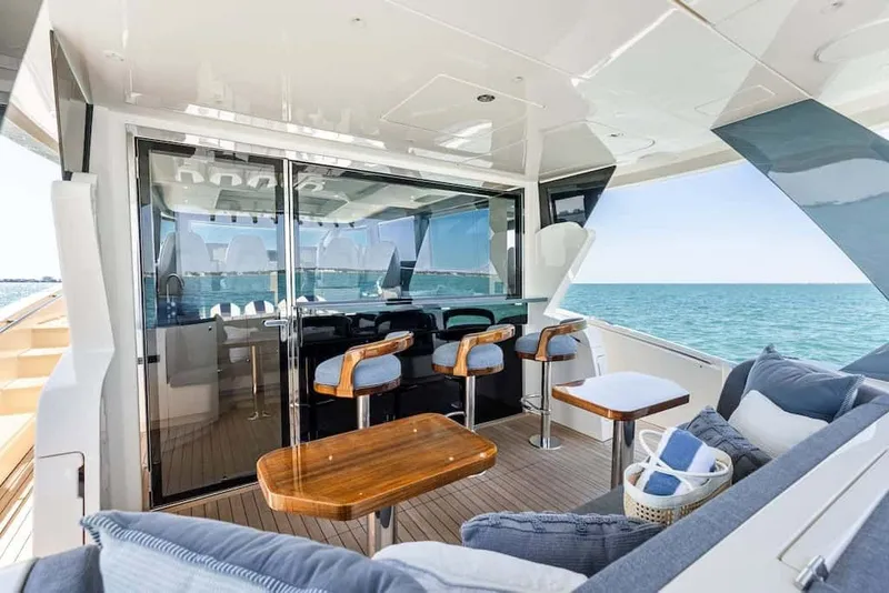 Slide: The Image of Luxurious 2026 Scout 670 LX yacht interior with ocean view, featuring elegant seating and modern design. - 28