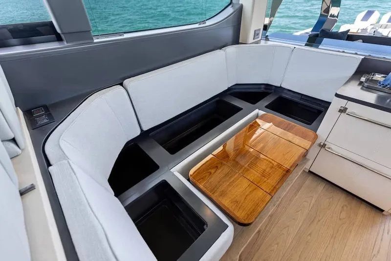 Slide: The Image of Luxurious interior of 2026 Scout 670 LX yacht with elegant seating and wooden table. - 29