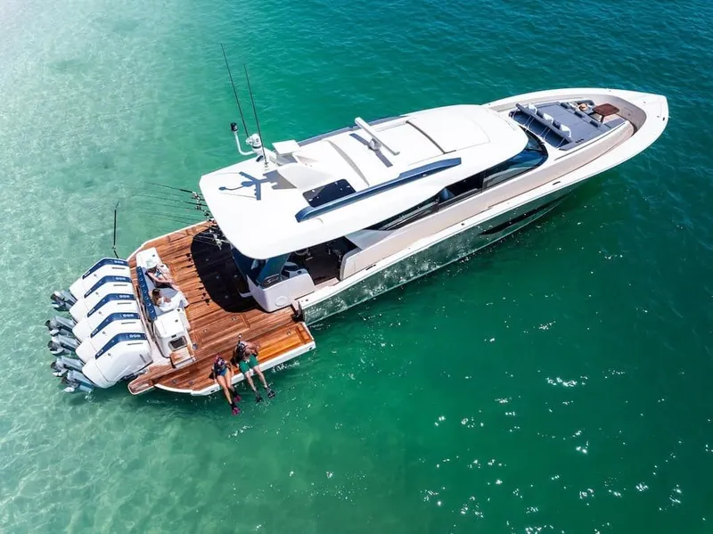 Slide: The Image of Aerial view of 2026 Scout 670 LX yacht on clear turquoise water. - 37