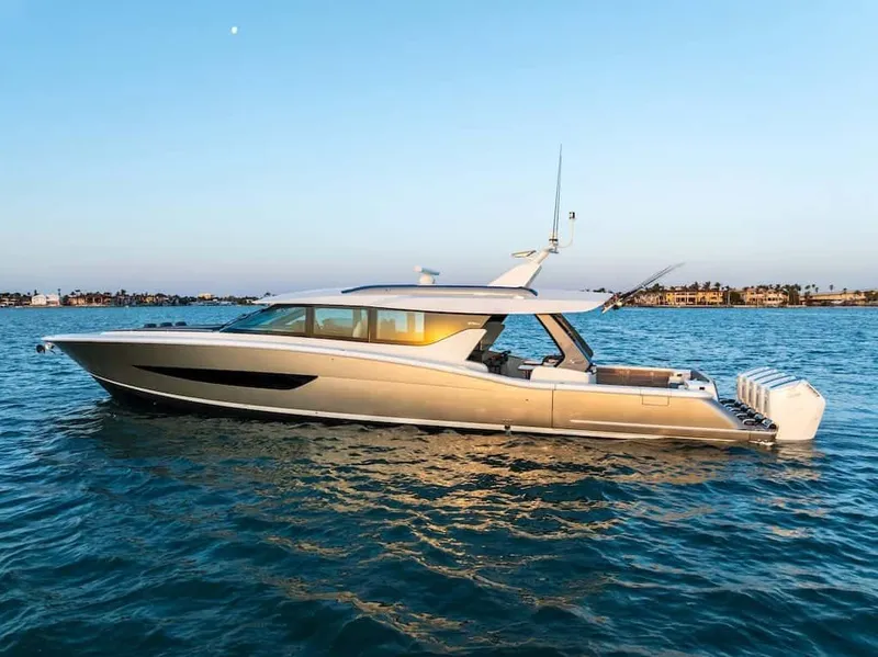 Slide: The Image of 2026 Scout 670 LX luxury yacht cruising on calm waters at sunset. - 38
