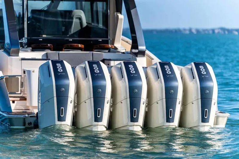 Slide: The Image of Five powerful outboard engines on a 2026 Scout 670 LX boat in blue waters. - 44