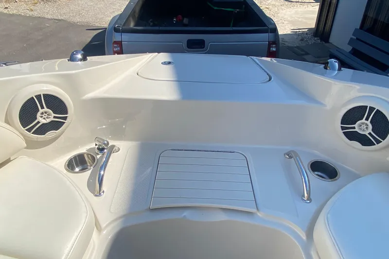 Slide: The Image of 2008 Sea Ray 260 Sundeck boat interior with speakers and cup holders. - 10