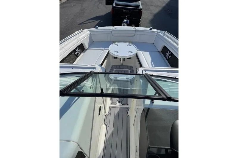 Slide: The Image of 2019 Sea Ray SDX 290 Outboard boat interior with seating and table. - 17