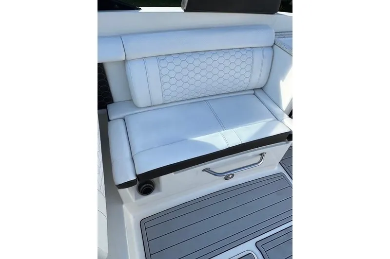 Slide: The Image of 2019 Sea Ray SDX 290 Outboard boat seat with white upholstery and hexagonal pattern. - 24