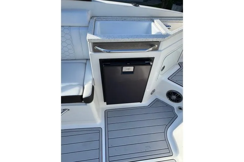 Slide: The Image of 2019 Sea Ray SDX 290 Outboard boat interior with sink and storage compartment. - 25