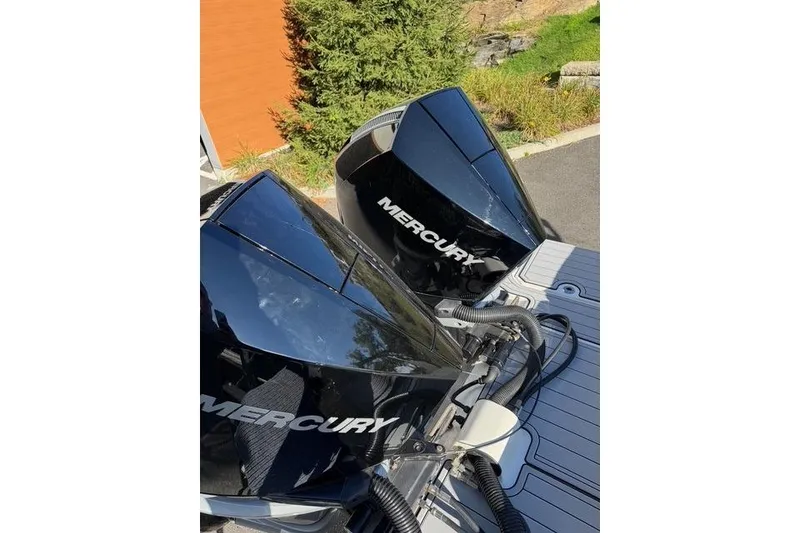 Slide: The Image of 2019 Sea Ray SDX 290 Outboard with dual Mercury engines, docked outdoors. - 3