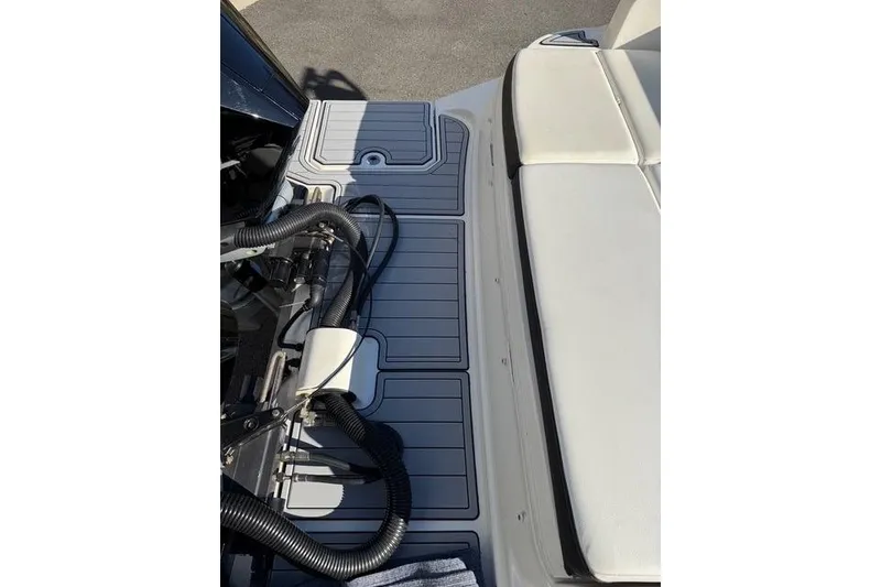 Slide: The Image of 2019 Sea Ray SDX 290 Outboard boat deck with seating and engine components. - 5