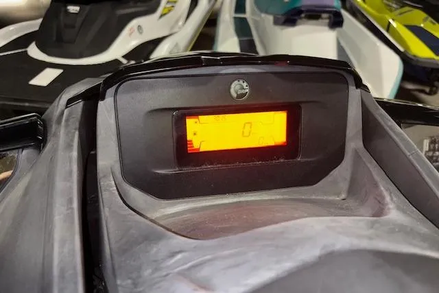 Slide: The Image of 2021 Sea-Doo GTX dashboard display with illuminated screen in a showroom setting. - 15