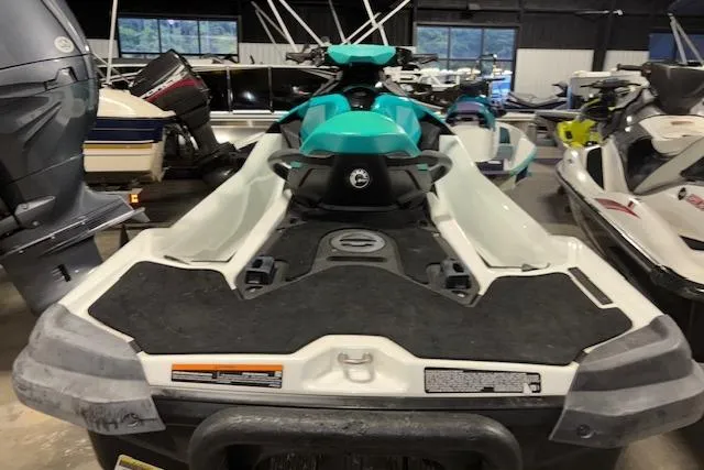 Slide: The Image of 2021 Sea-Doo GTX jet ski in a showroom, featuring a sleek design and turquoise accents. - 8