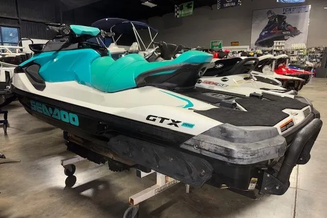 Slide: The Image of 2021 Sea-Doo GTX personal watercraft displayed in a showroom. - 9