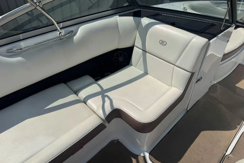Slide: The Image of Interior of a 2013 Cobalt 220 boat with white leather seating. - 20