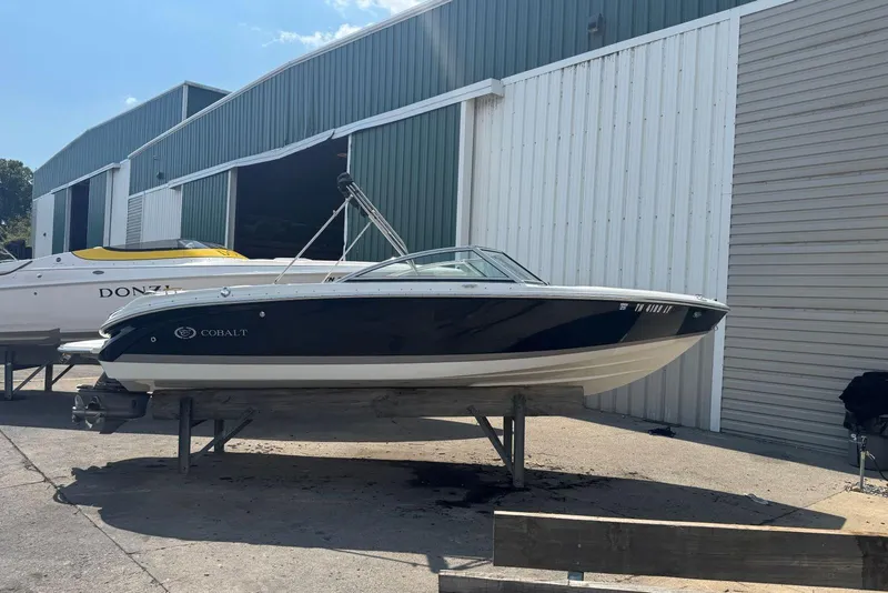 Slide: The Image of 2013 Cobalt 220 boat on a stand outside a storage facility. - 3