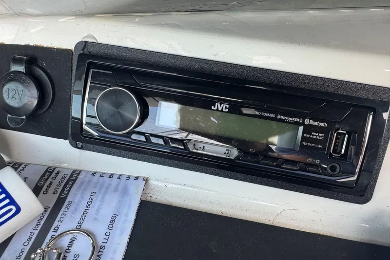 Slide: The Image of JVC stereo system in a 2013 Cobalt 220 boat dashboard with USB and Bluetooth features. - 36