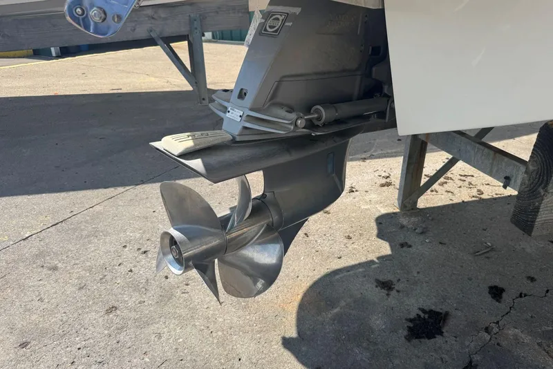 Slide: The Image of 2013 Cobalt 220 boat propeller and outdrive on a trailer. - 8