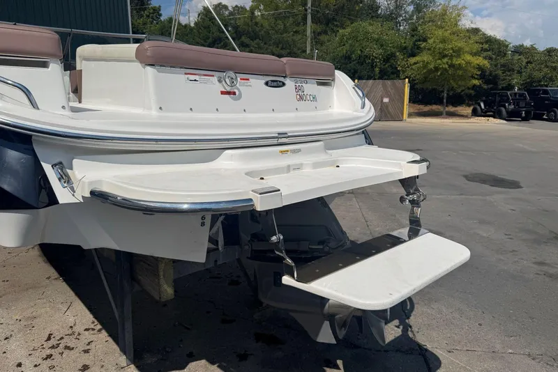 Slide: The Image of Rear view of a 2013 Cobalt 220 boat with swim platform and ladder. - 9