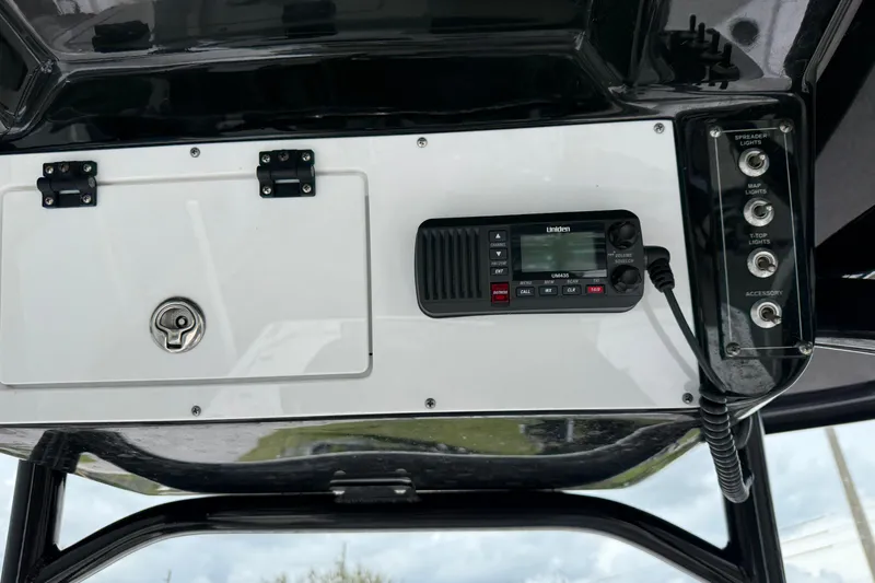 Slide: The Image of 2023 Sea Pro 248 Bay boat console with radio and control panel. - 17