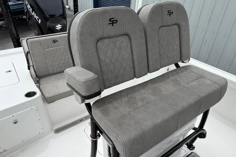 Slide: The Image of 2023 Sea Pro 248 Bay boat seating with gray upholstery and diamond stitching. - 19