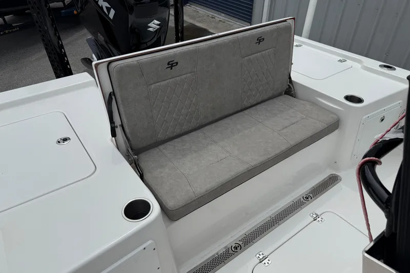 Slide: The Image of 2023 Sea Pro 248 Bay boat with cushioned seating and cup holders. - 20