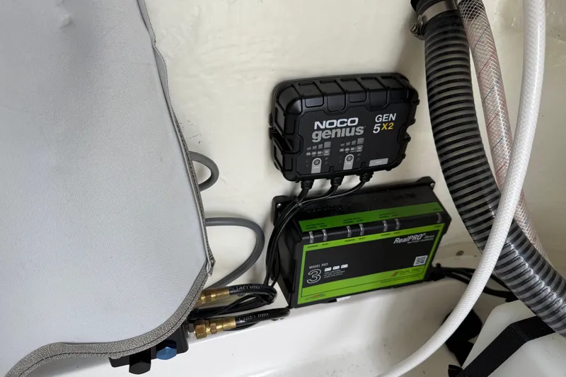 Slide: The Image of NOCO Genius GEN5X2 charger in 2023 Sea Pro 248 Bay boat, with RealPRO battery system. - 21