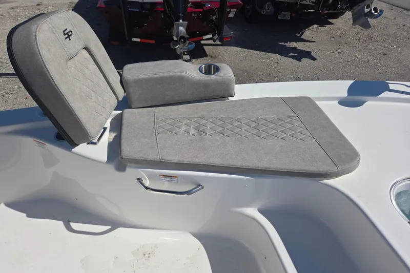 Slide: The Image of 2023 Sea Pro 248 Bay boat seat with gray upholstery and cup holder. - 31