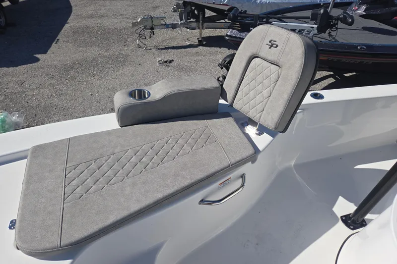 Slide: The Image of 2023 Sea Pro 248 Bay boat seating with cup holder, featuring diamond-stitched upholstery. - 32