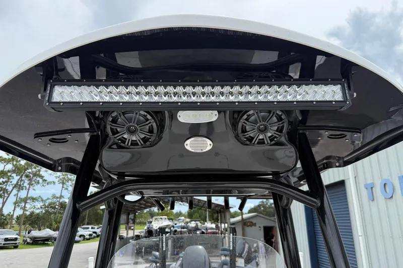 Slide: The Image of 2023 Sea Pro 248 Bay boat T-top with LED light bar and speakers. - 7