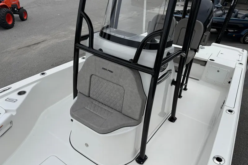 Slide: The Image of 2023 Sea Pro 248 Bay boat interior with seating and console. - 8