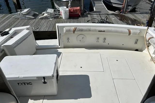 Slide: The Image of 2001 Wellcraft 330 Coastal boat deck with RTIC cooler, docked at marina. - 14