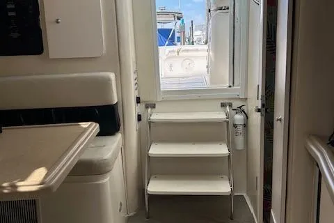 Slide: The Image of Interior view of 2001 Wellcraft 330 Coastal boat with steps leading outside. - 5