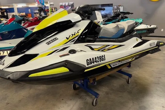 Slide: The Image of 2021 Yamaha WaveRunner VX-C Jetski in showroom, white and yellow design. - 3