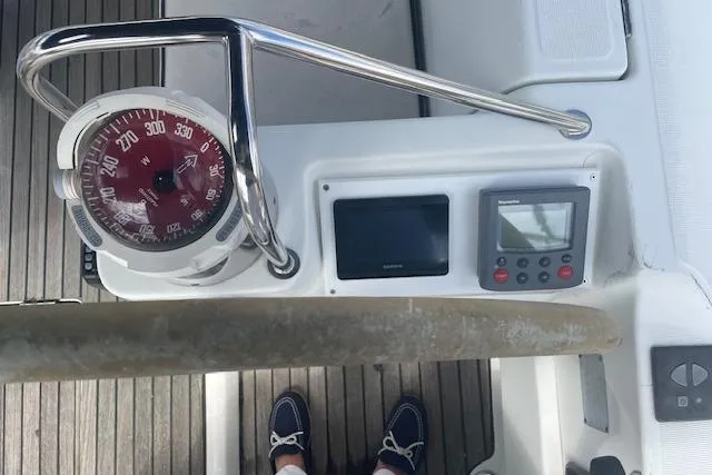 Slide: The Image of Control panel of a 2002 Jeanneau Sun Odyssey 45.2 sailboat with compass and navigation instruments. - 10