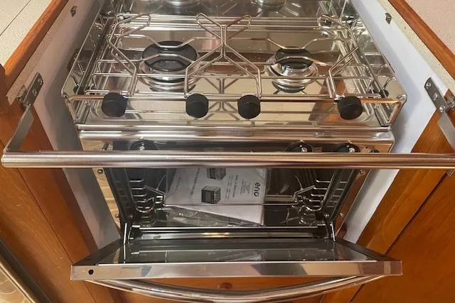 Slide: The Image of Stainless steel stove and oven in Jeanneau Sun Odyssey 45.2 yacht kitchen, 2002 model. - 22