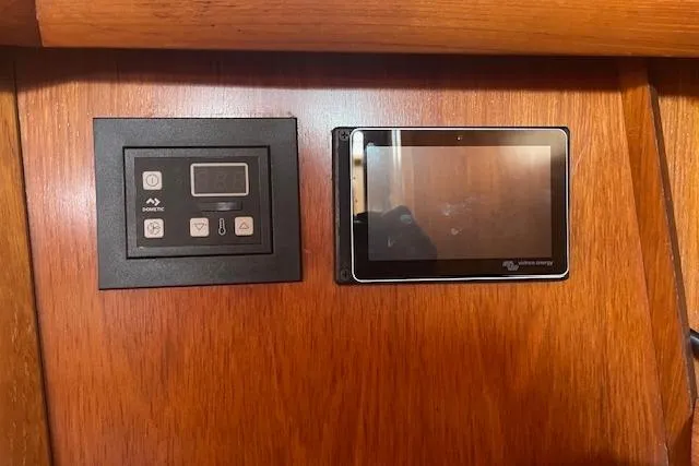 Slide: The Image of Control panels on Jeanneau Sun Odyssey 45.2 yacht, 2002 model, mounted on wooden interior. - 26