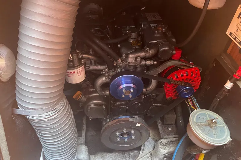 Slide: The Image of Engine compartment of a 2002 Jeanneau Sun Odyssey 45.2 sailboat, showing mechanical components. - 29