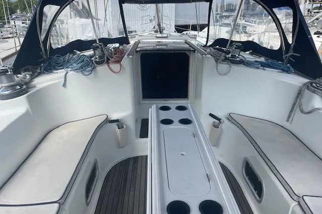 Slide: The Image of Cockpit of 2002 Jeanneau Sun Odyssey 45.2 sailboat with seating and ropes. - 4