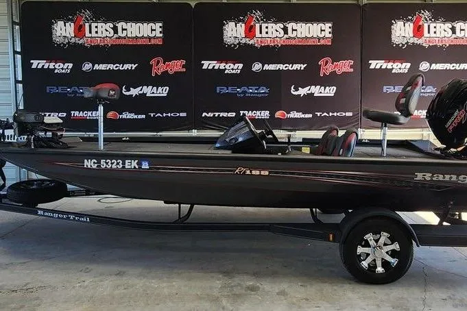Slide: The Image of 2006 Sea Hunt Escape 200 boat on trailer with Yamaha outboard motor in showroom. - 2